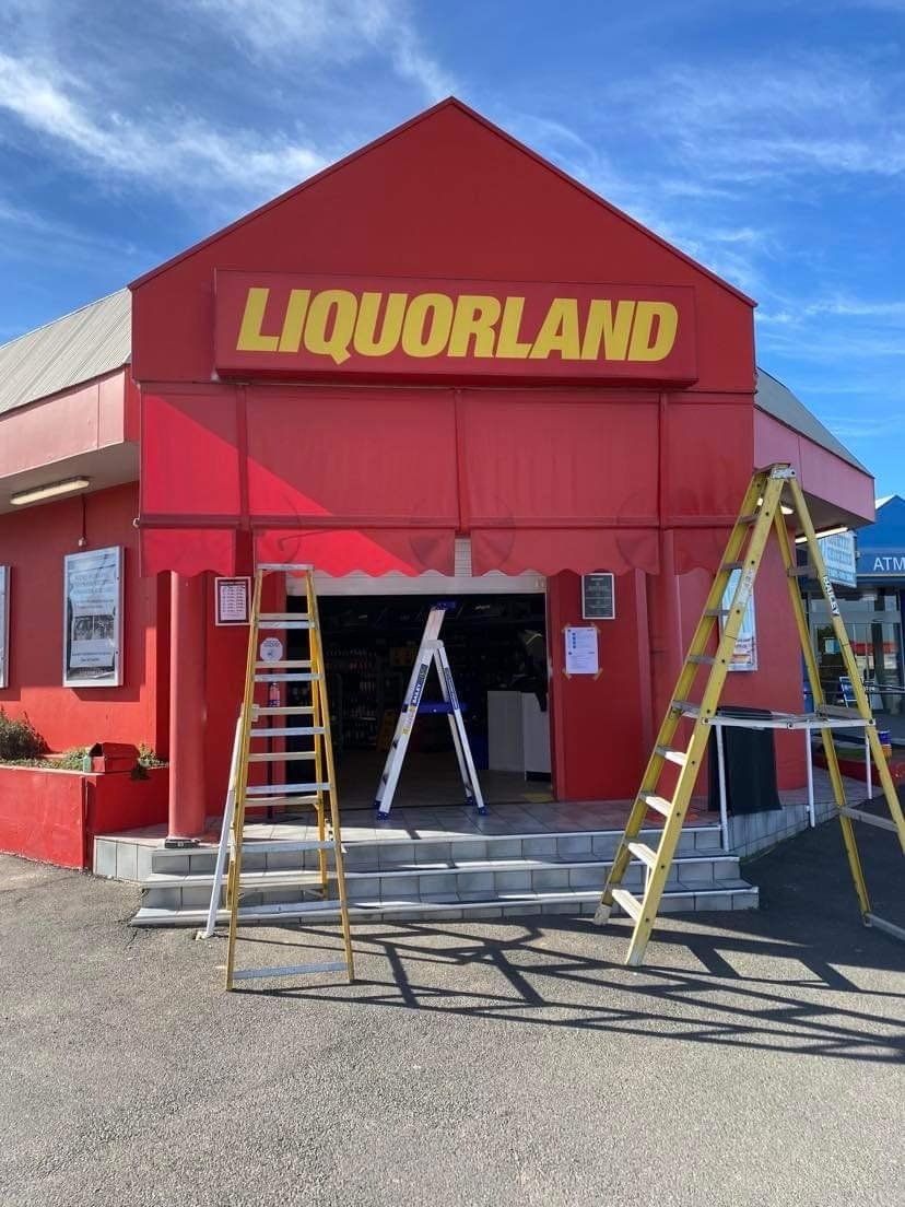 Liquorland with Red Awnings — Tamworth Blinds & Awnings in Tamworth, NSW