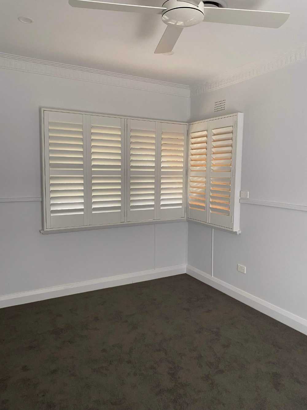 Empty Bedroom with Newly Furnished Shutters — Tamworth Blinds & Awnings in Tamworth, NSW