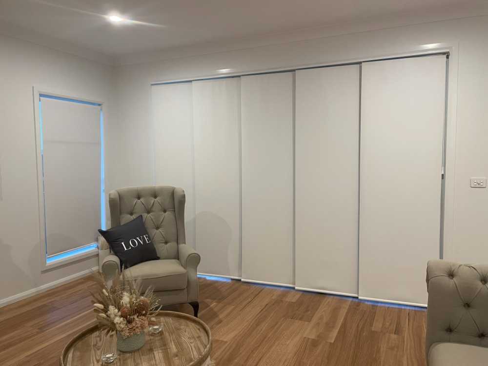 A Room with a Window Blinds Chair and Table — Tamworth Blinds & Awnings in Tamworth, NSW