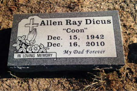 A gray granite grave marker for Allen Ray Dicus “Coon,” inscribed with dates 1942–2010 and the phrase “My Dad Forever.”