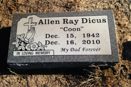 A gray granite grave marker for Allen Ray Dicus “Coon,” inscribed with dates 1942–2010 and the phrase “My Dad Forever.”