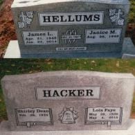 Two gravestones, one inscribed 