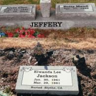 Grave markers for Alvin Cleo and Betty Maud Jeffery, and a separate marker for Elwanda Lee Jackson, in a grassy cemetery.