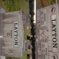 A side-by-side view of a granite tombstone for Arthur and Emily Layton, showing their names and dates of life.