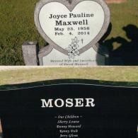 A heart-shaped headstone for Joyce Pauline Maxwell sits behind a black granite memorial for the Moser family.