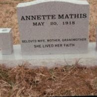 A grey granite headstone engraved 