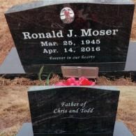 Black polished granite headstone for Ronald J. Moser (1945–2016) inscribed 