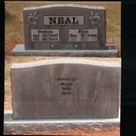 A dual-sided gravestone marked 