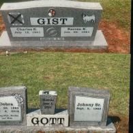 Two granite headstones in a cemetery; one inscribed 