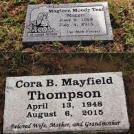 Two gray granite grave markers set in grass. Top: Magleen Moody Teal (1928-2015). Bottom: Cora B. Mayfield Thompson (1948-2015).