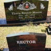 Two dark polished granite headstones in a grassy cemetery, one inscribed with 