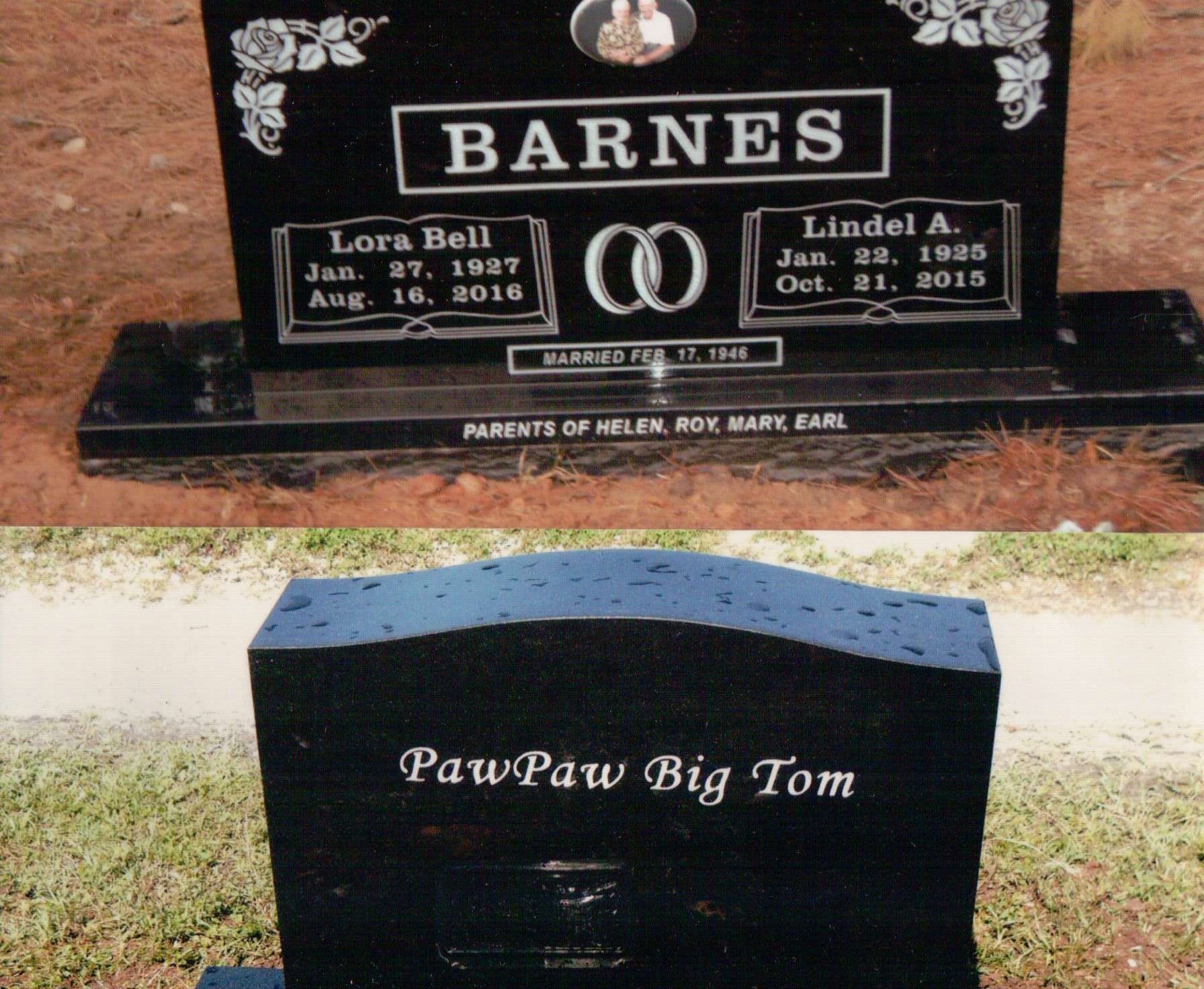 Two black granite grave markers; one inscribed 