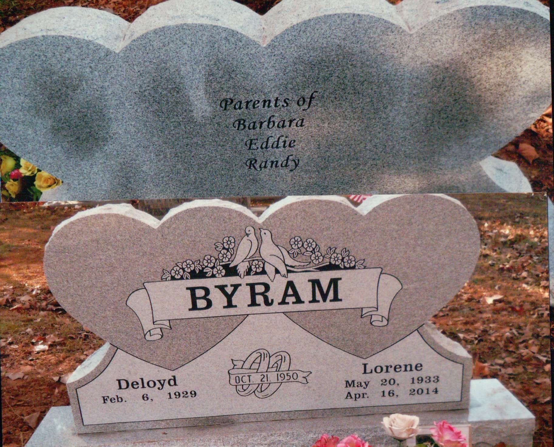 A heart-shaped granite headstone for the Byram family, inscribed with names, dates, and 