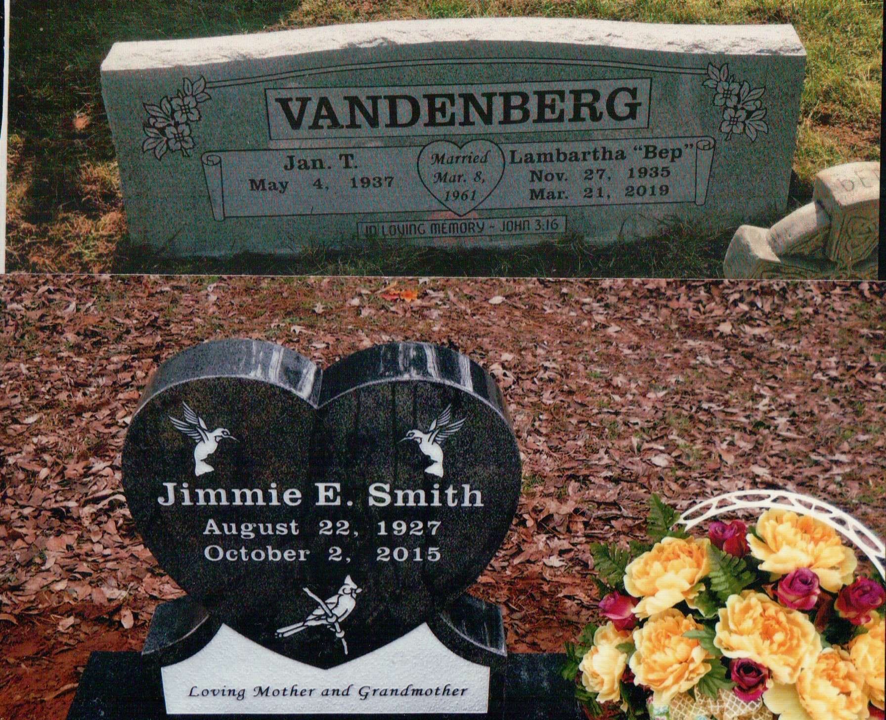 Two gravestones in an outdoor setting: a light-colored rectangular Vandenberg monument and a heart-shaped black stone.