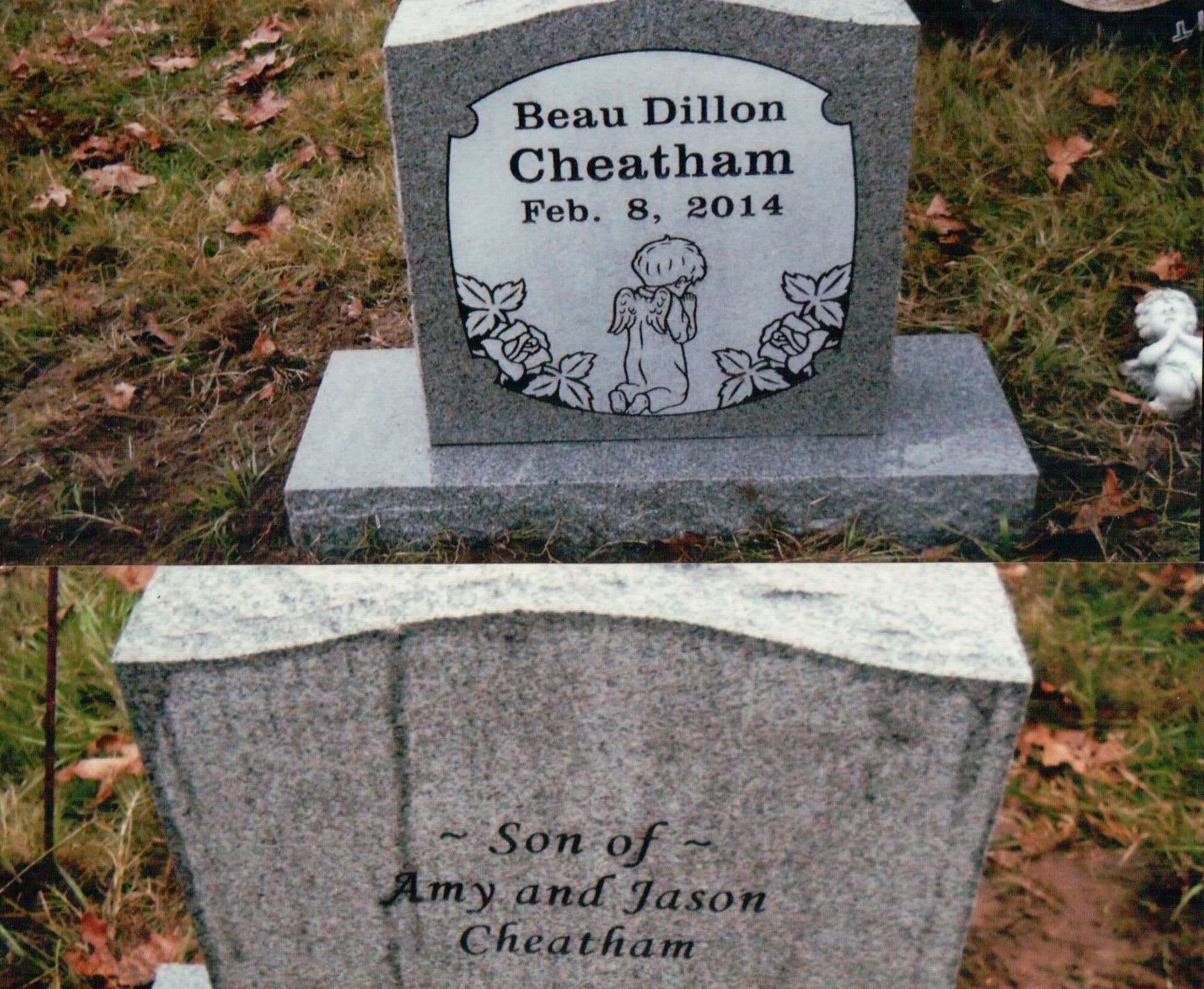 A gray granite headstone inscribed 