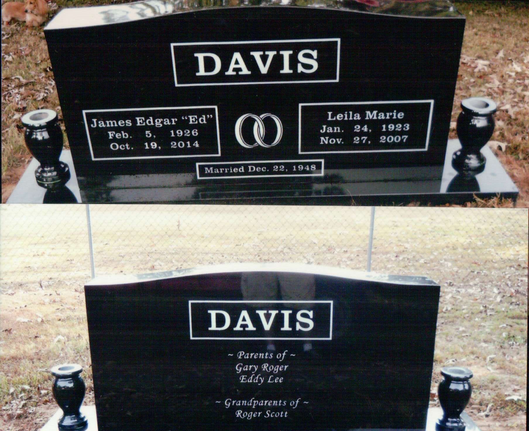 Front and back view of a black granite Davis family headstone with two vases on a grave site.