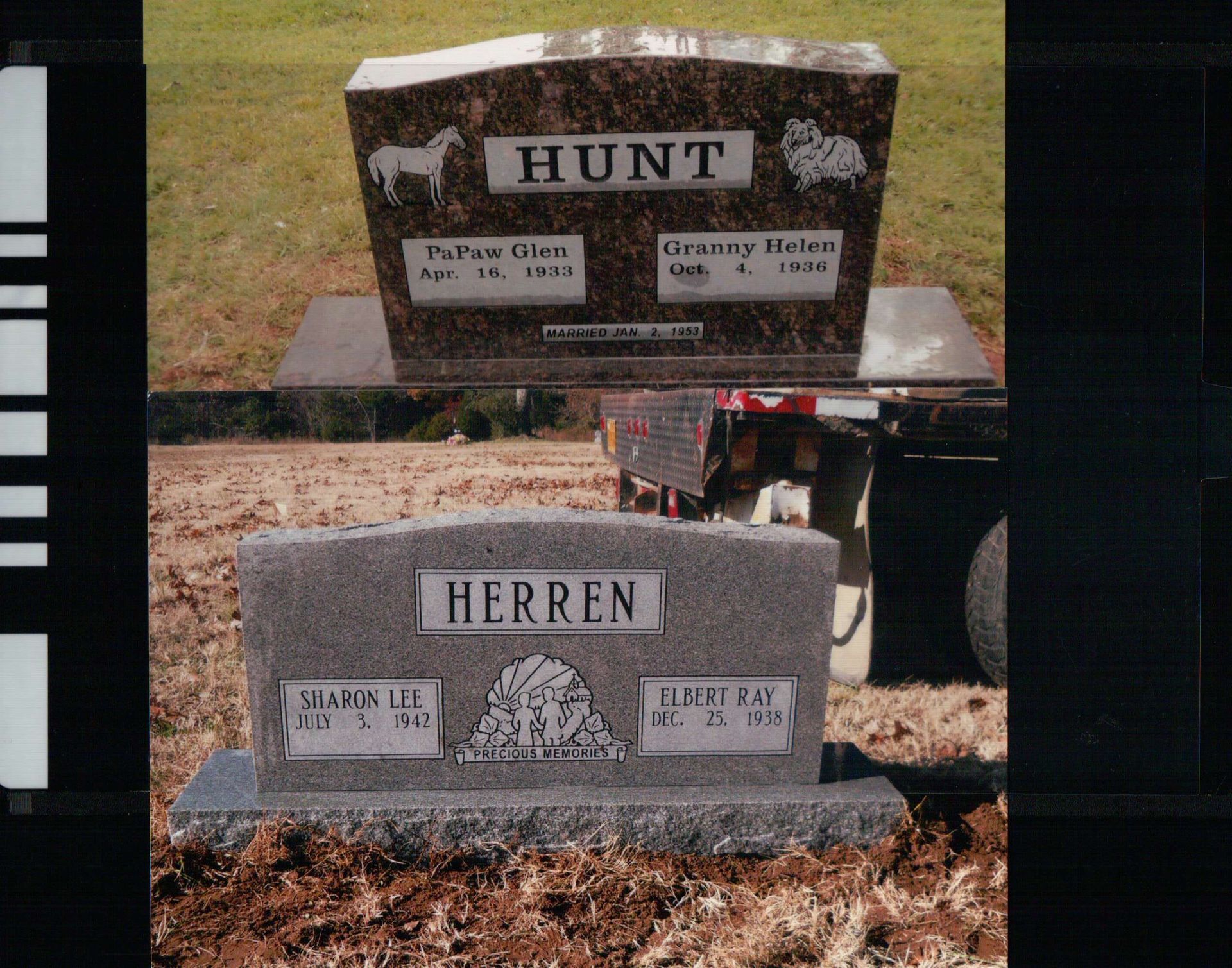 Two granite headstones, the top brown and the bottom gray, sitting in a grassy area with a vehicle in the background.