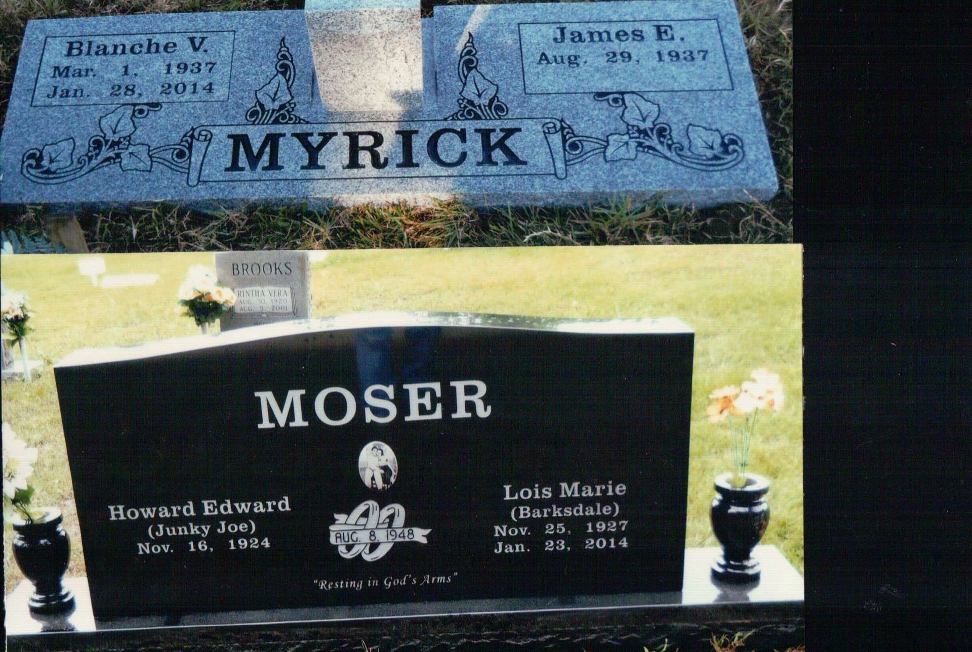 Two headstones in a cemetery: a gray stone for the Myrick family and a black stone for the Moser family.