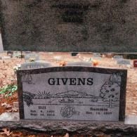 A grey stone grave marker for 