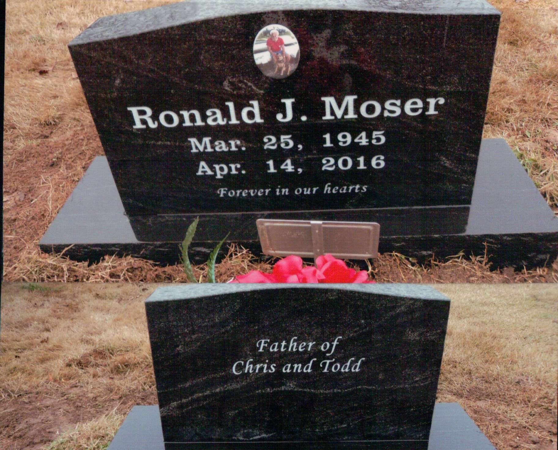 A black granite tombstone for Ronald J. Moser (1945–2016) with a photo inset, inscribed 