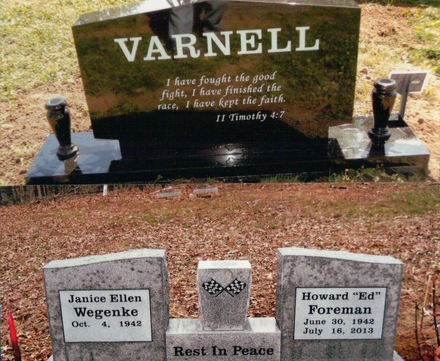 Two gravestones: one black monument with a Bible verse, and another gray double headstone for Janice Wegenke and Ed Foreman.