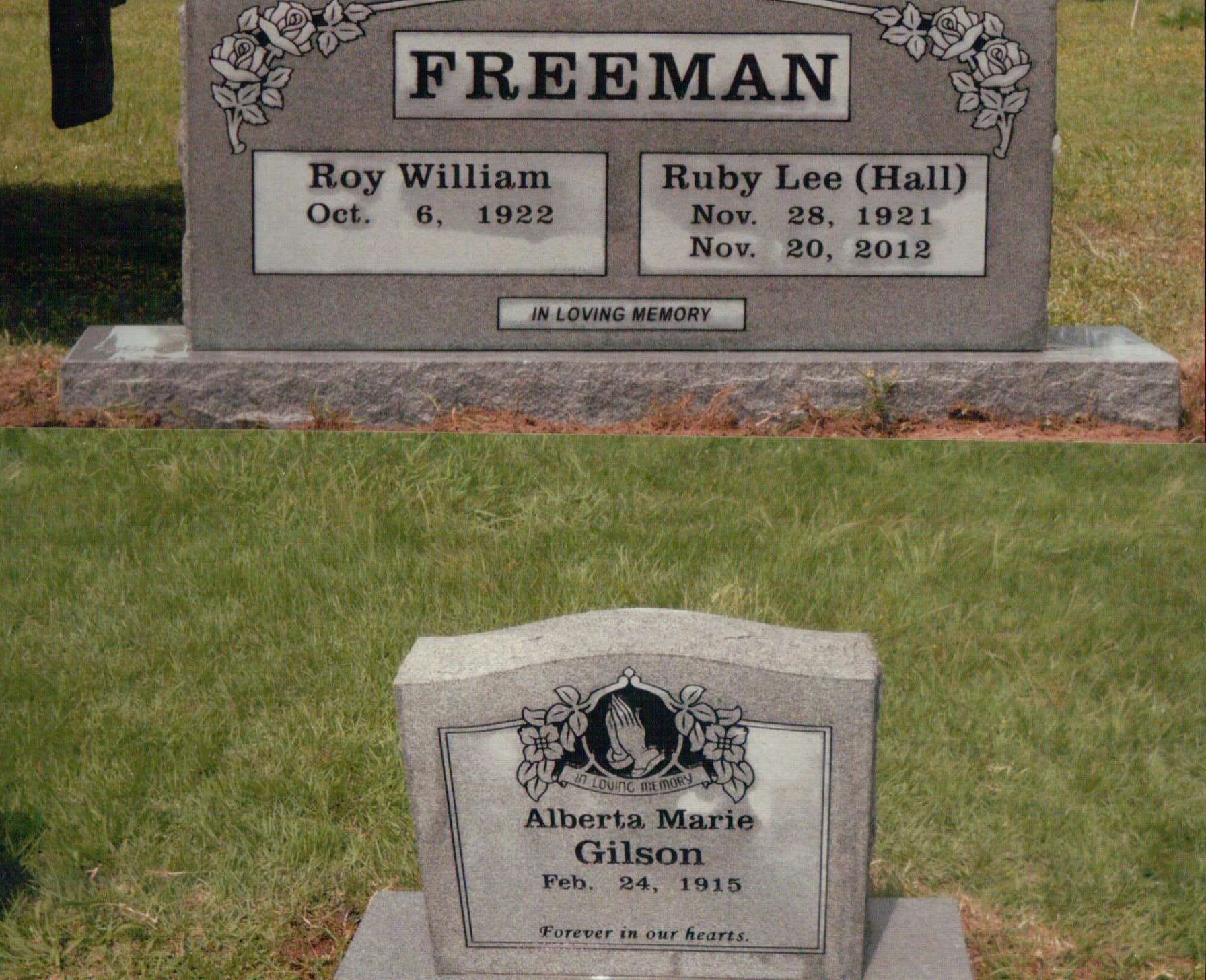 Two gravestones in a grassy cemetery: one marked 