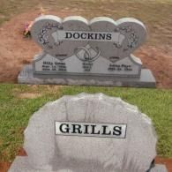 Two separate gray stone grave markers, one engraved 