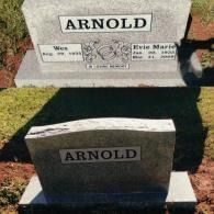 A two-part image showing a grave marker for the Arnold family before and after the engraving of specific dates.