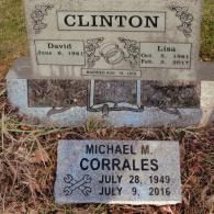 Two stone grave markers on grass. The top marker reads 