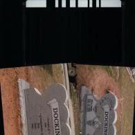 Two grey stone grave markers with the name 