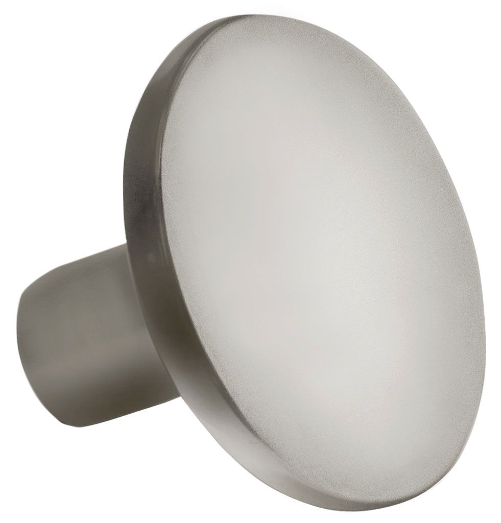 A stainless steel knob with a small hole in the middle
