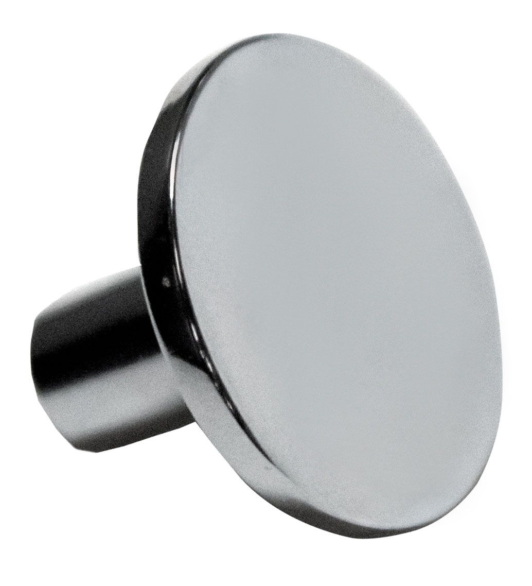 A round metal object with a hole in the middle on a white background