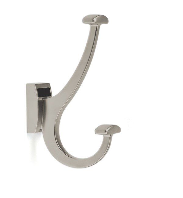 A stainless steel coat hook is hanging on a white wall.