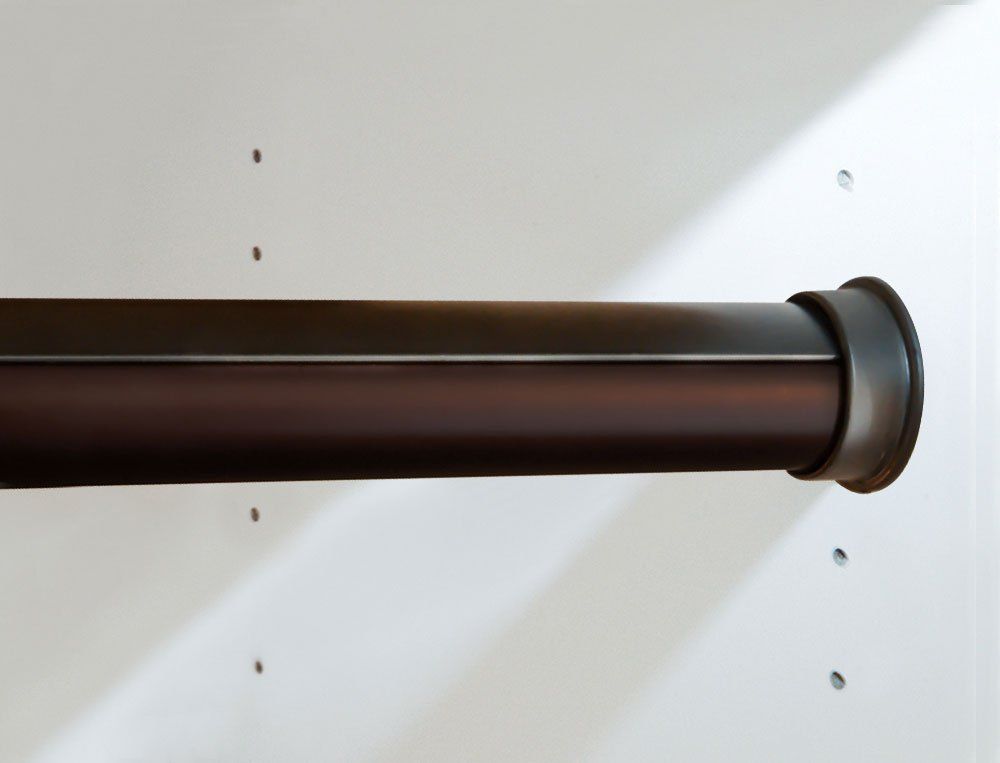 A close up of a brown pipe on a white wall