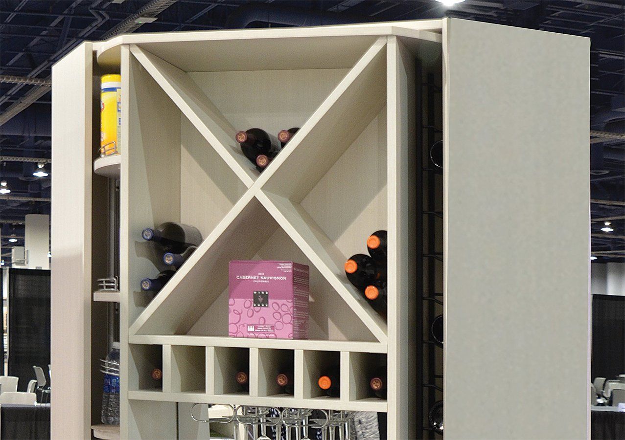 A wine rack with bottles and glasses on it