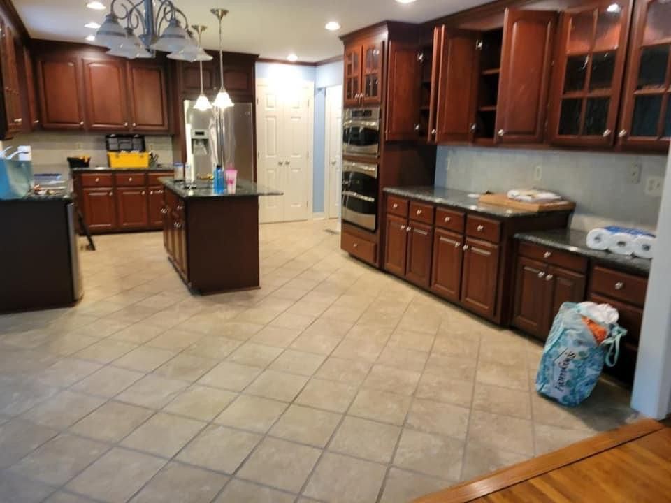 a kitchen with wooden cabinets and stainless steel appliances