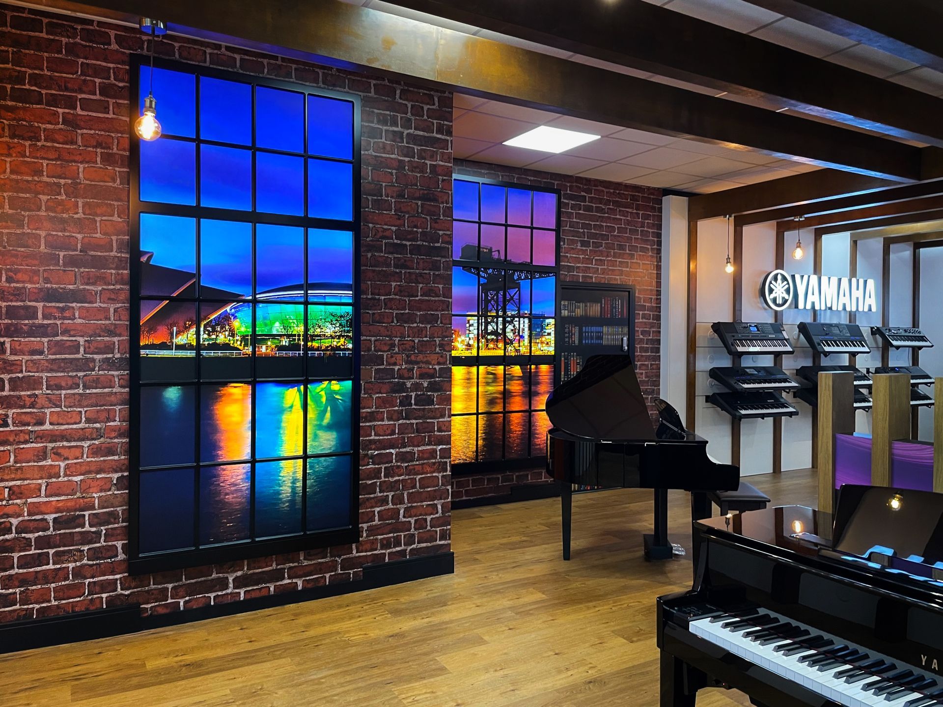 Yamaha branded retail space with custom illuminated logo and lightbox graphics 