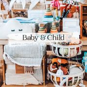 Baby and children's toys and blankets on display in a store.