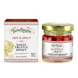 Jar of white truffle honey, red label, and box of hot & spicy white truffle honey.