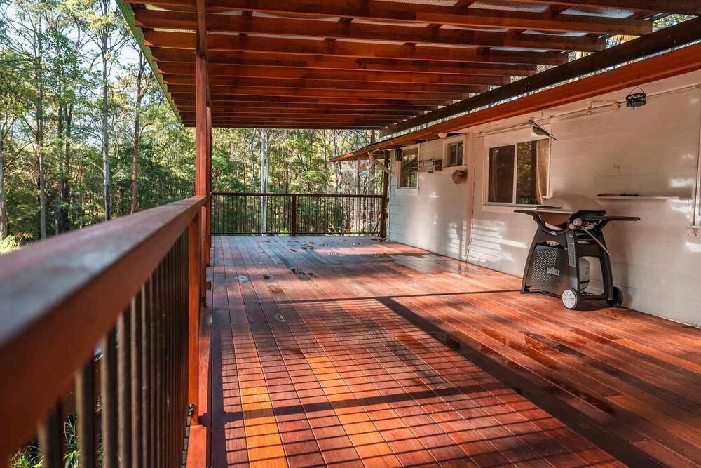 A Wooden Deck With A Grill And A Table Saw On It — Sedah Home Improvements In Port Macquarie, NSW
