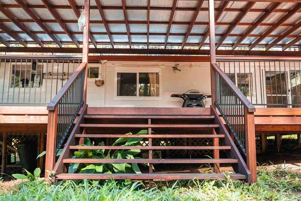 A Wooden Deck With Stairs Leading Up To It — Sedah Home Improvements In Port Macquarie, NSW