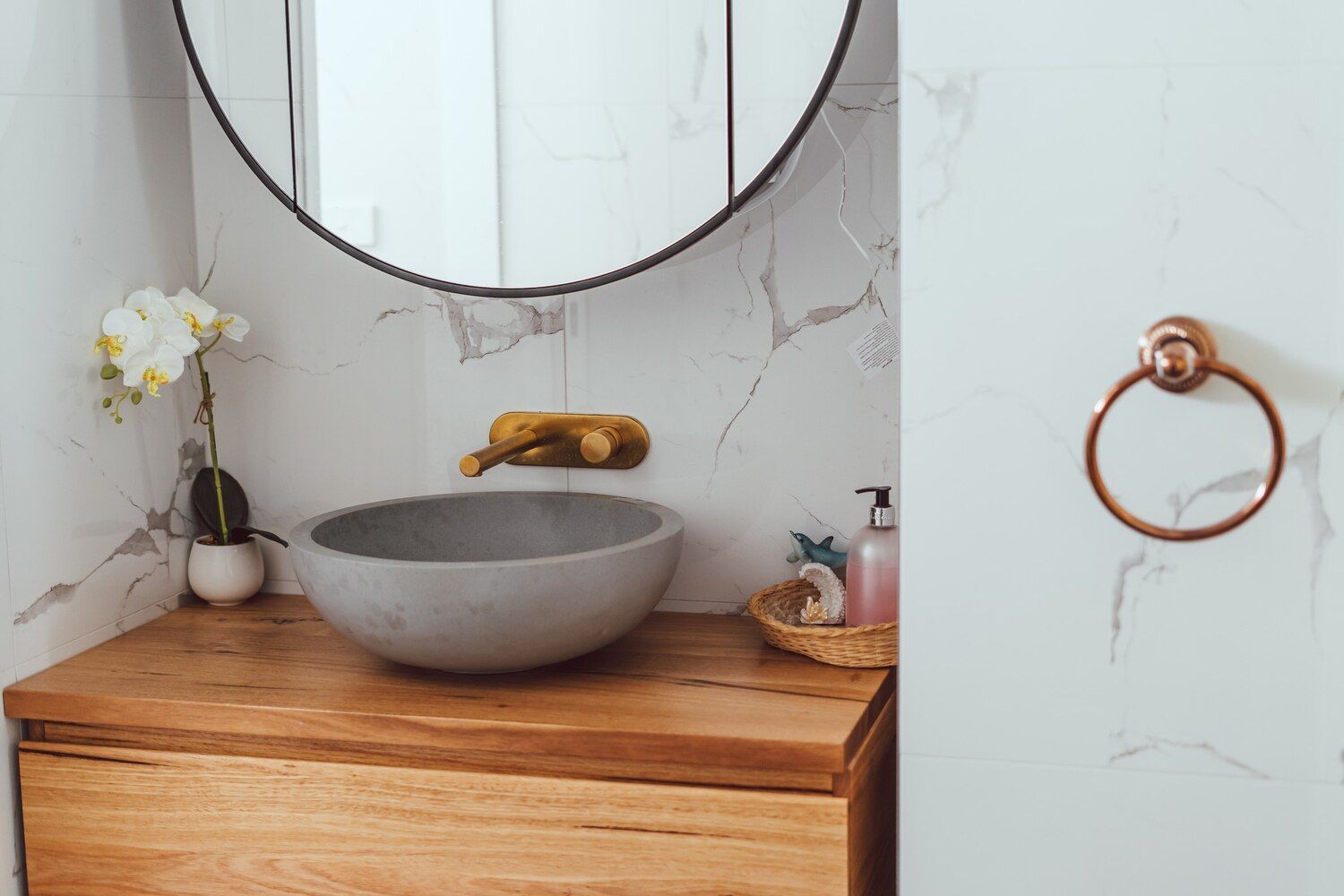 A Bathroom With A Sink , Mirror And Wooden Cabinet — Sedah Home Improvements In Port Macquarie, NSW