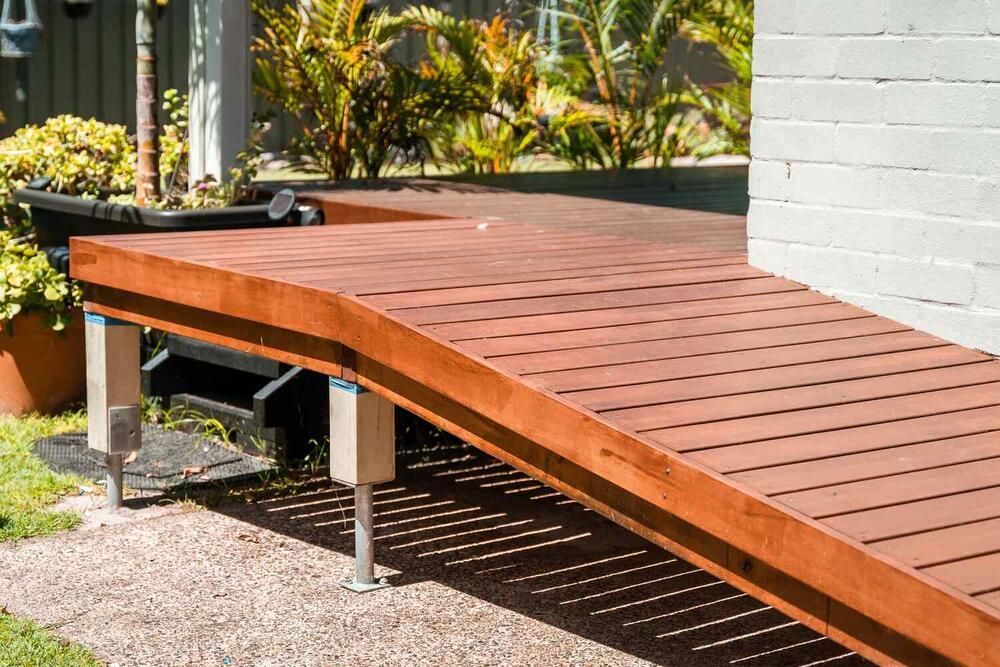A Wooden Deck With A Ramp Attached To It — Sedah Home Improvements In Port Macquarie, NSW