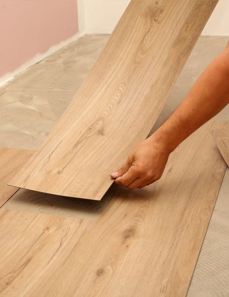 Installing New Vinyl Tile Floor — Bourbonnais, IL — Heartland Cabinetry & More