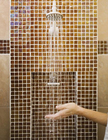 Woman Under Shower — Bourbonnais, IL — Heartland Cabinetry & More