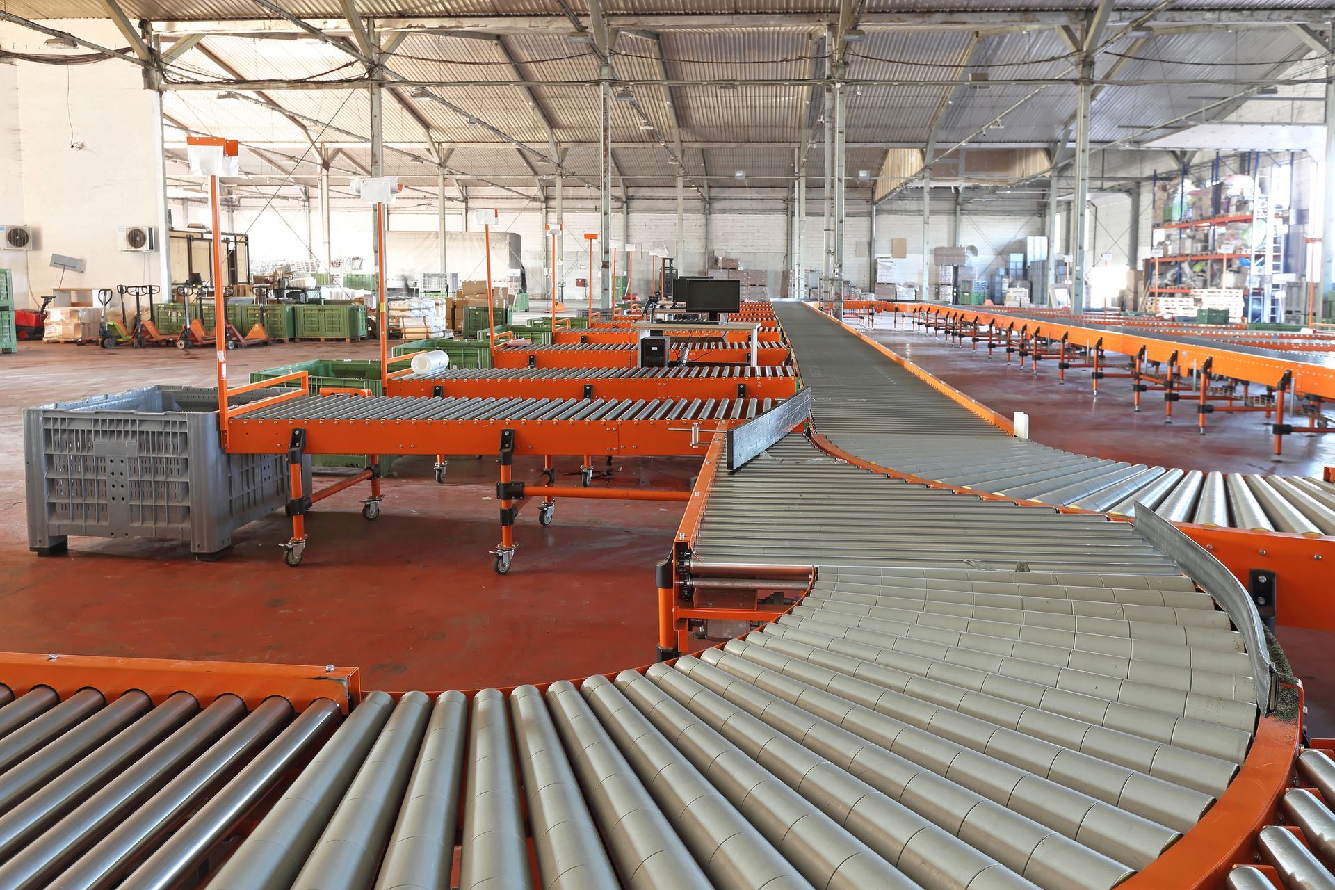 Warehouse interior with orange conveyor belts and containers. Warehouse interior with orange conveyor belts and containers.