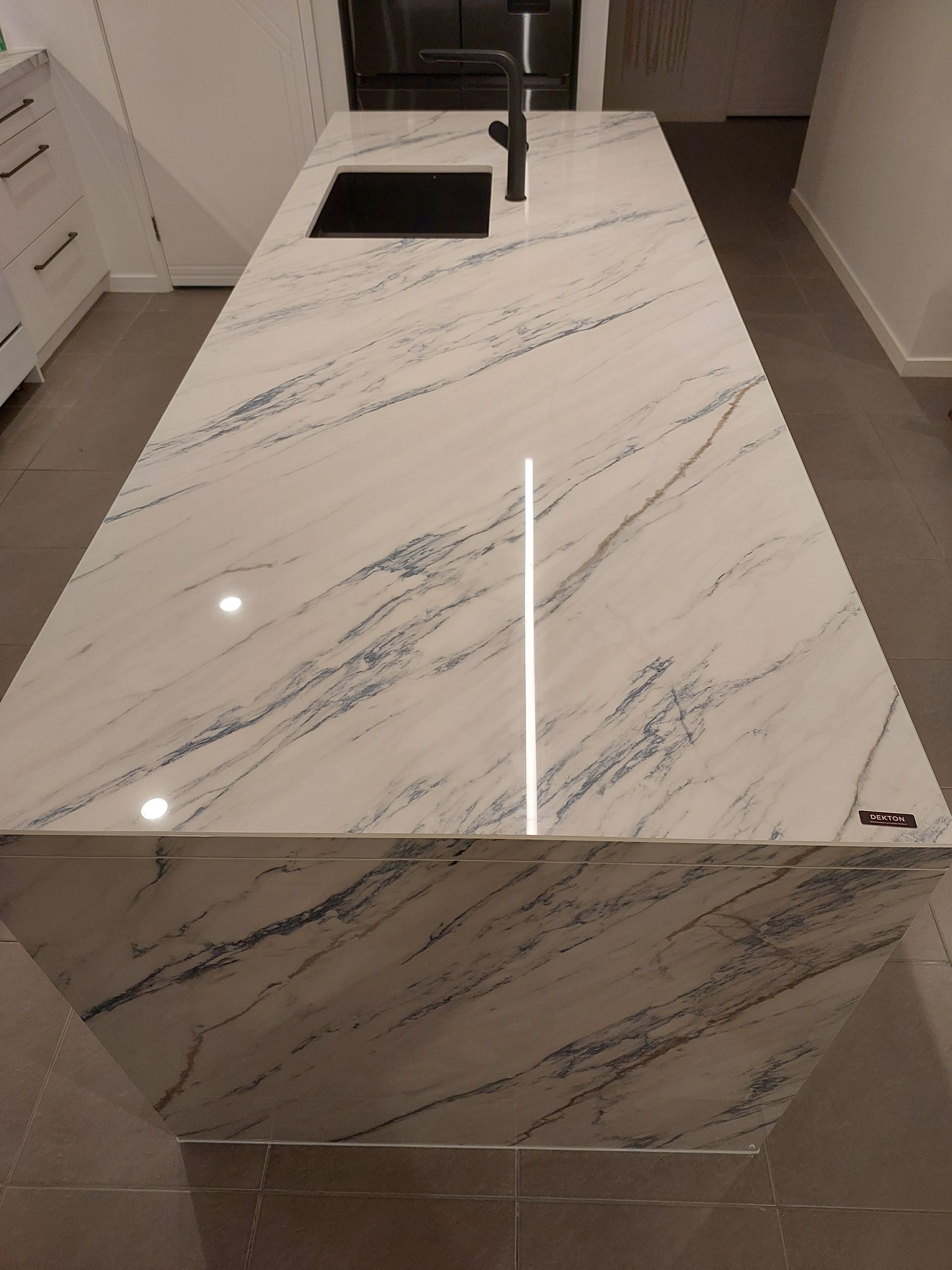 A Kitchen With a Marble Counter Top and a Sink — Stone Effects In Forest Glen, QLD