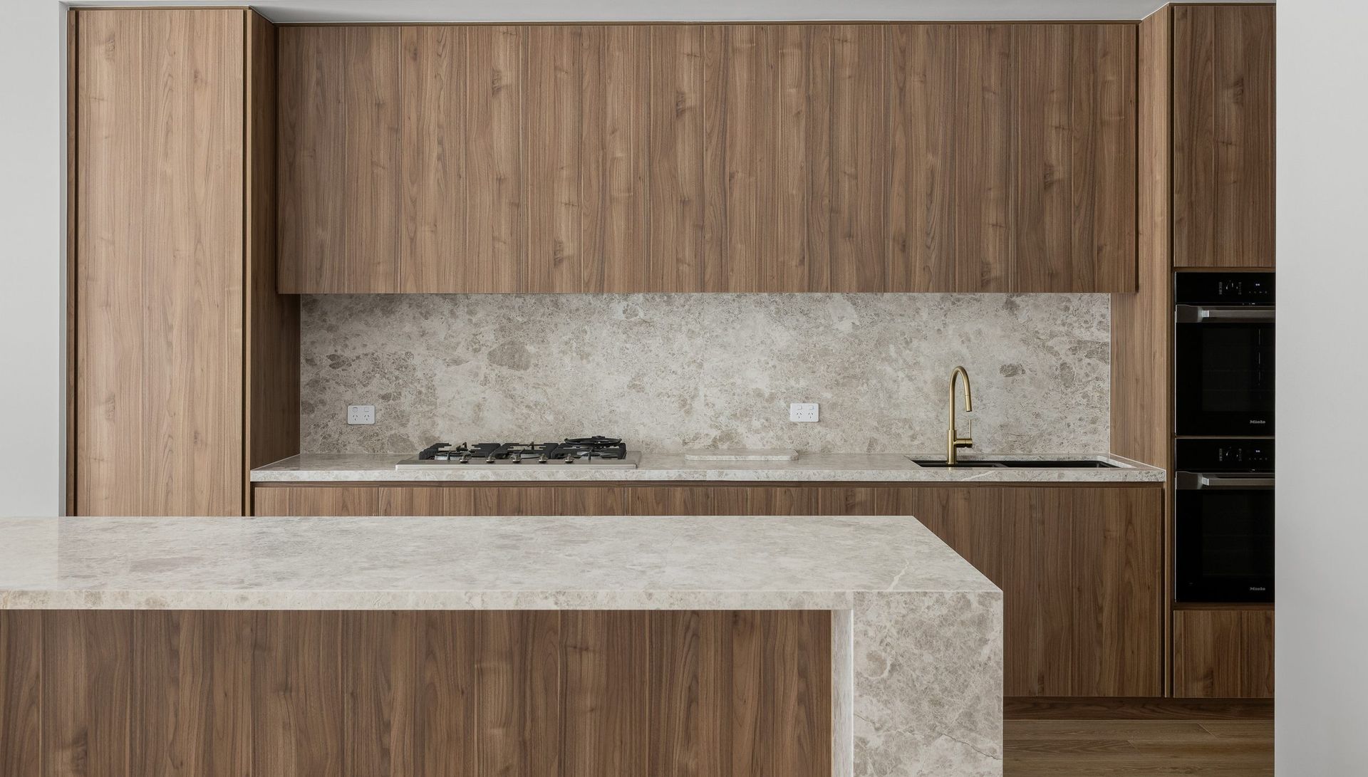 A Kitchen With a Large Island and a Sink — Stone Effects In Forest Glen, QLD