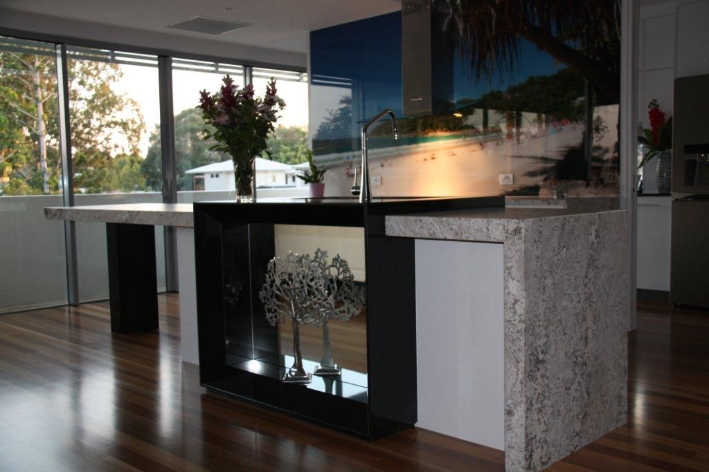A Kitchen With a Large Island and a Painting on the Wall — Stone Effects In Forest Glen, QLD