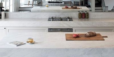 A Kitchen With a Cutting Board and a Cup of Tea on the Counter — Stone Effects In Forest Glen, QLD